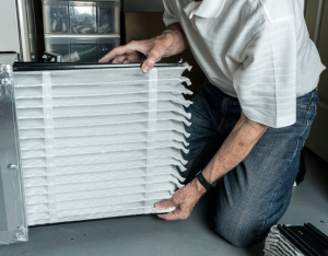 Changing the furnace filter in a house in Glen Ellyn, Illinois