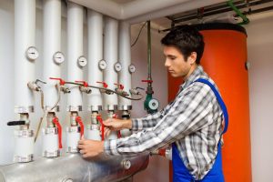 man working on heater